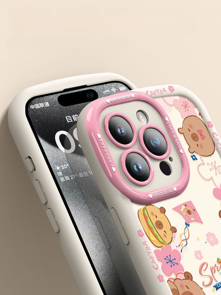 An iPhone 16 Pro Max Cute Bear Silicone Case showcasing playful cartoon bear heads with various accessories. This case features a predominantly dark design accented with floral elements and the "Spring Time" text at its center. It offers not just style but also shockproof protection due to its soft touch liquid silicone construction, ensuring durability and anti-scratch properties.