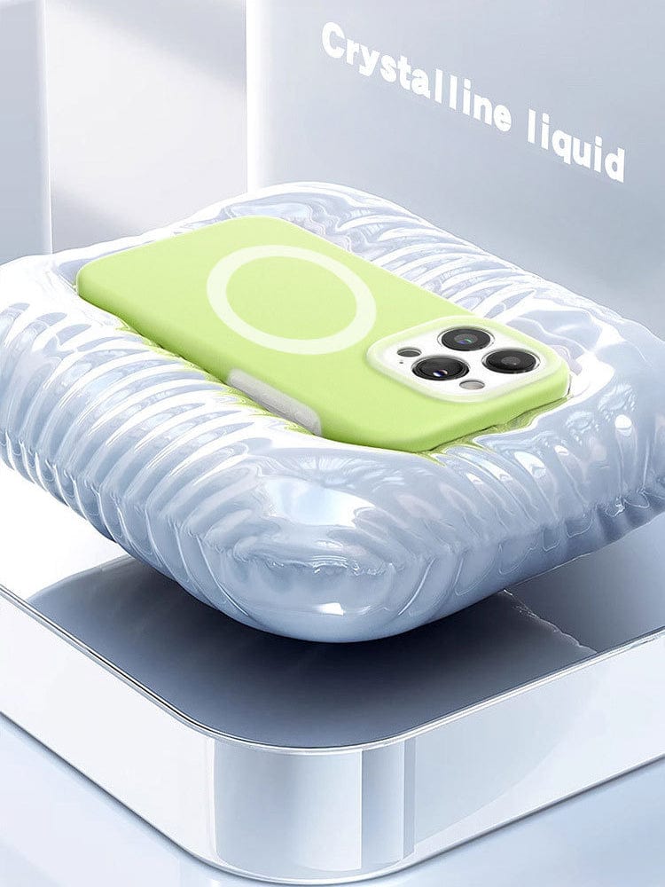 A MagSafe Compatible iPhone 16 Pro Max case in green is displayed on a shiny, cushion-like platform with the text "Premium Liquid Silicone Gel" visible in the background.