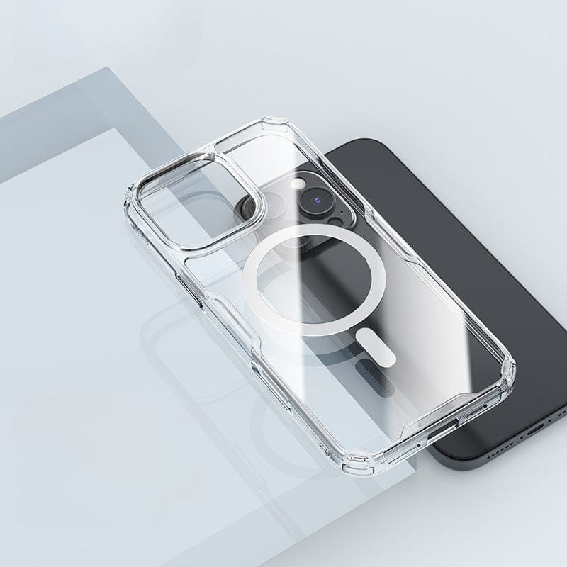 A Clear Magnetic iPhone 16 Pro Max Case with shockproof protection and MagSafe compatibility is placed on top of a black smartphone, set on a light-colored surface.