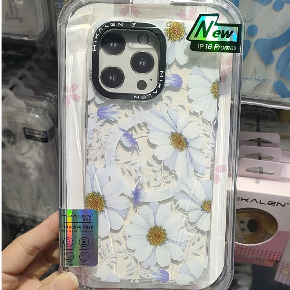 A Floral MagSafe iPhone 16 Pro Max Case featuring a 3D flower design with white and purple flowers is displayed in packaging, combining stylish elegance with shockproof protection. This TPU + PC protective shell keeps your phone secure while adding a touch of charm.