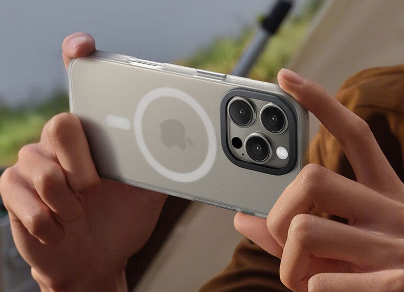 A person holding a smartphone with an iPhone 16 Pro Max MagSafe Case | X-002 Hdens Matte Finish Shockproof Cover, displaying the back camera and Apple logo.