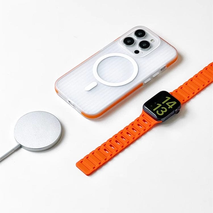 A smartphone with an iPhone 16 Pro Max Case featuring a corrugated matte texture, MagSafe compatibility, and a shockproof slim design, an orange smartwatch, and a wireless charger on a white surface.