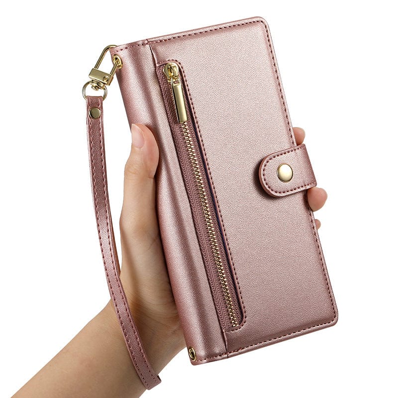 A hand holds an iPhone 16 Pro Max wallet case with a card holder, zipper pocket, snap button closure, and detachable strap made from premium leather material.