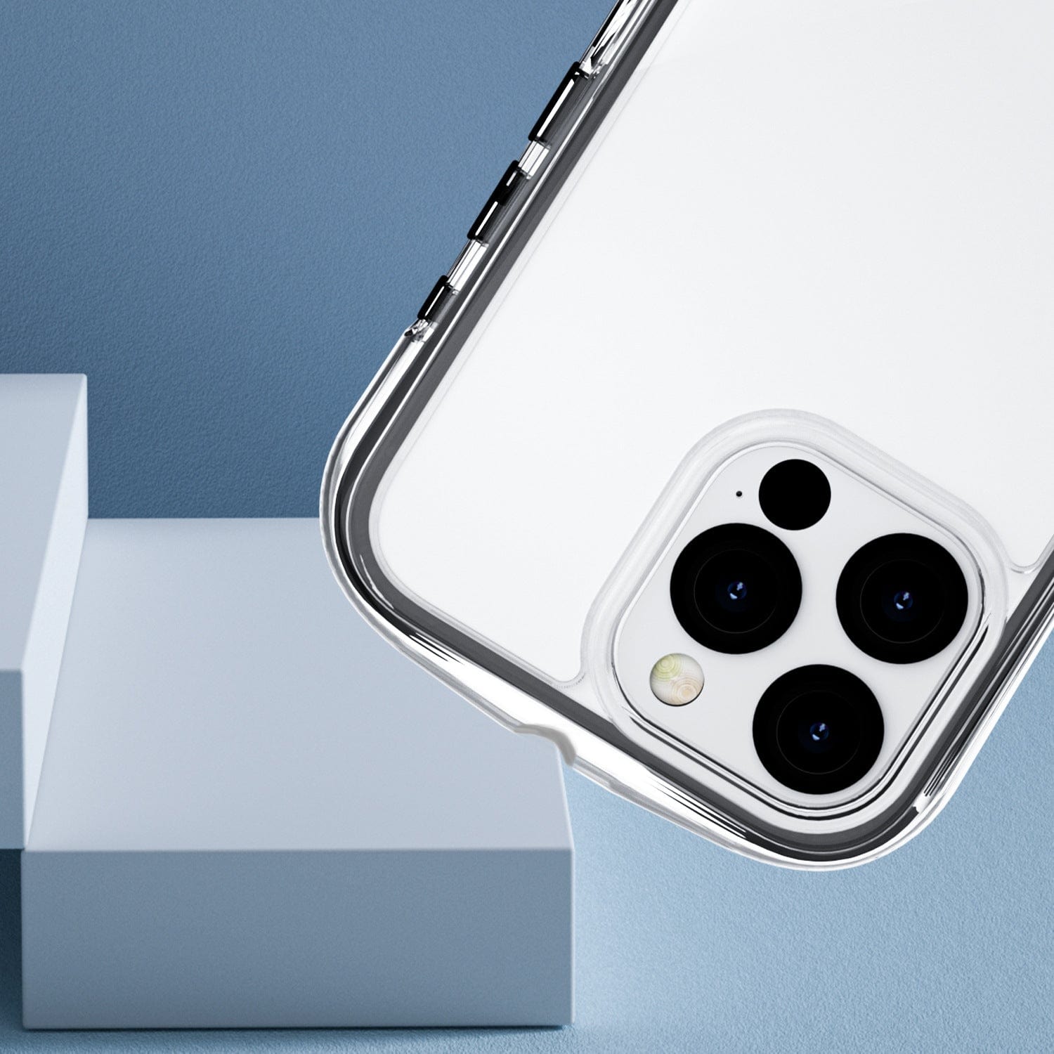 An iPhone 16 Pro Max encased in an Air Cushion MagSafe Case, featuring its rear camera setup with three lenses and a flash, is showcased against a backdrop of light blue geometric shapes.