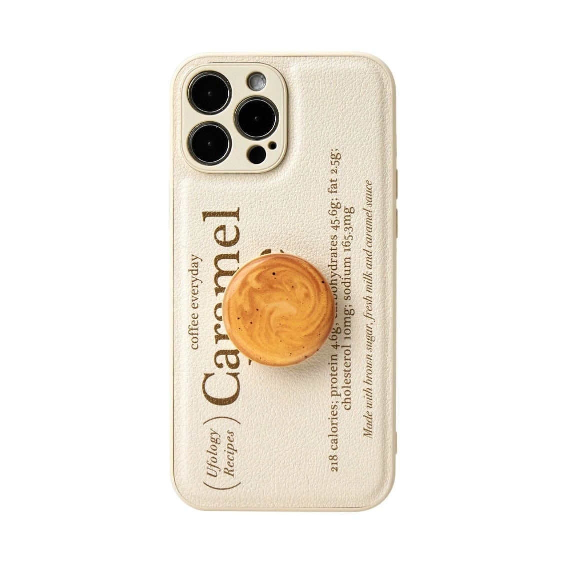 The Caramel Latte MagSafe iPhone 16 Pro Max Case, with its coffee-inspired design and integrated cup stand, adorns the phone. The beige case features text resembling a recipe for caramel and includes a matching beige pop socket in the shape of a cookie, positioned below the camera lenses. The design exudes both minimalism and whimsy.