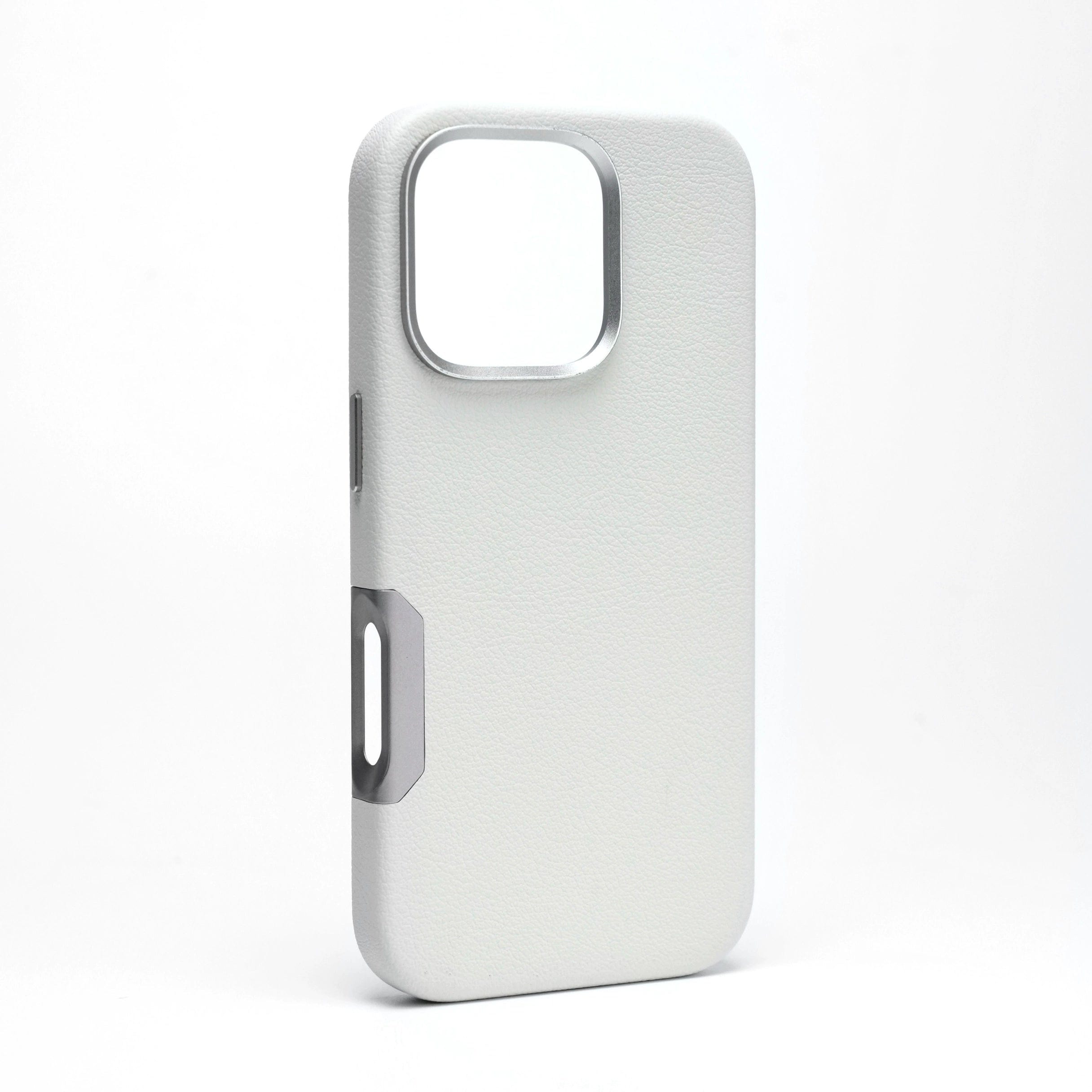 Enhance your iPhone 16 Pro Max with this sophisticated leather case, available in a sleek white design. Featuring precision aluminum alloy buttons and a raised camera frame, it perfectly complements the device's aesthetics. Showcased on a plain white background, the case also offers seamless MagSafe compatibility for effortless charging.