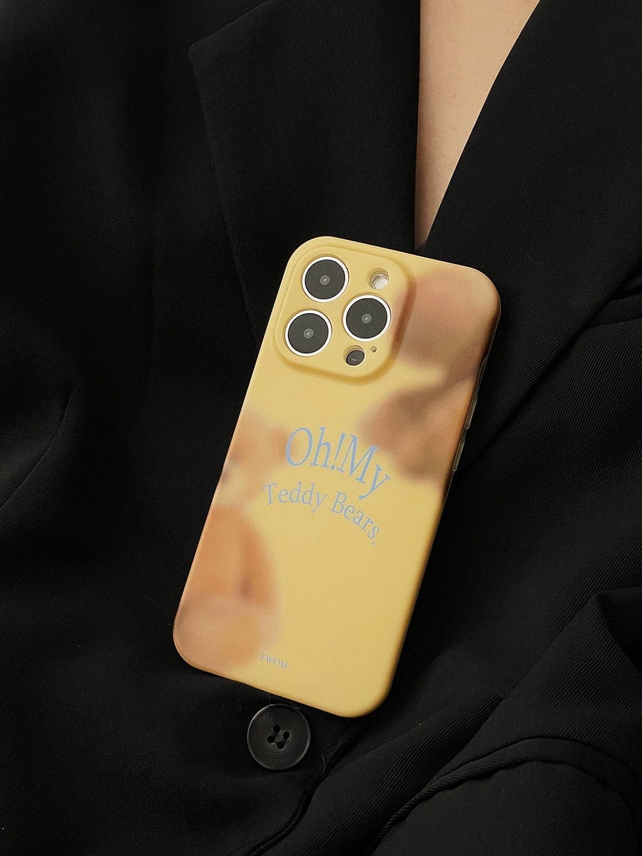 A person wearing a black jacket holds an "Oh! My Teddy Bears iPhone 16 Pro Max Case | Soft Matte Finish | Cute All-Inclusive Protective Cover" in yellow, with text that reads "Oh! My Teddy Bears" and an image of teddy bears surrounding the text.