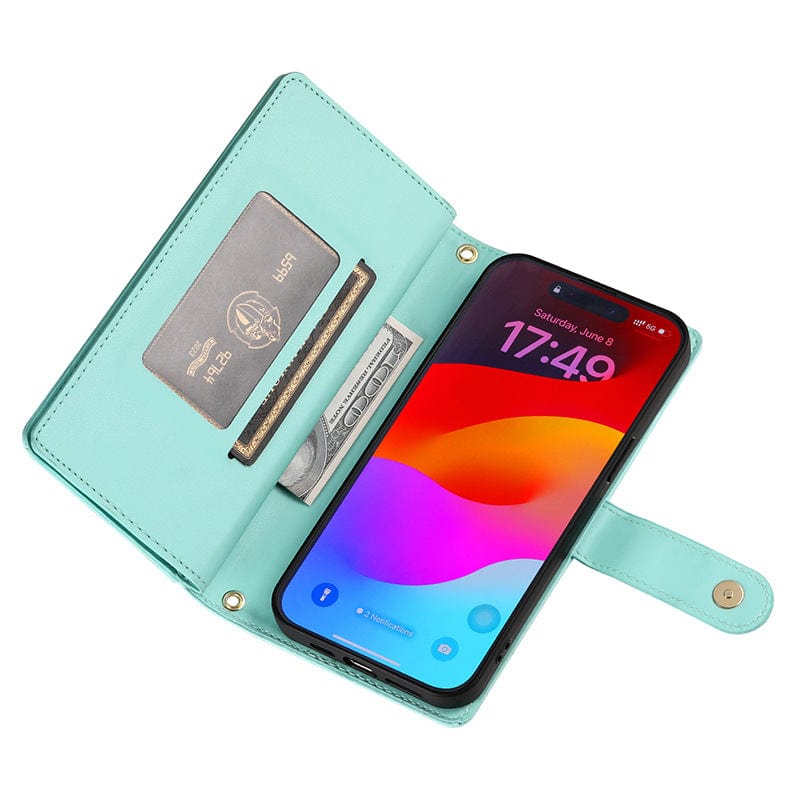 An iPhone 16 Pro Max Wallet Case with Card Holder, Zipper Pocket, and Stand Function is holding a smartphone with a colorful screen inside its open turquoise premium leather folio cover, which also contains a card and some cash for added convenience. This elegant case features a built-in stand function for hands-free viewing.