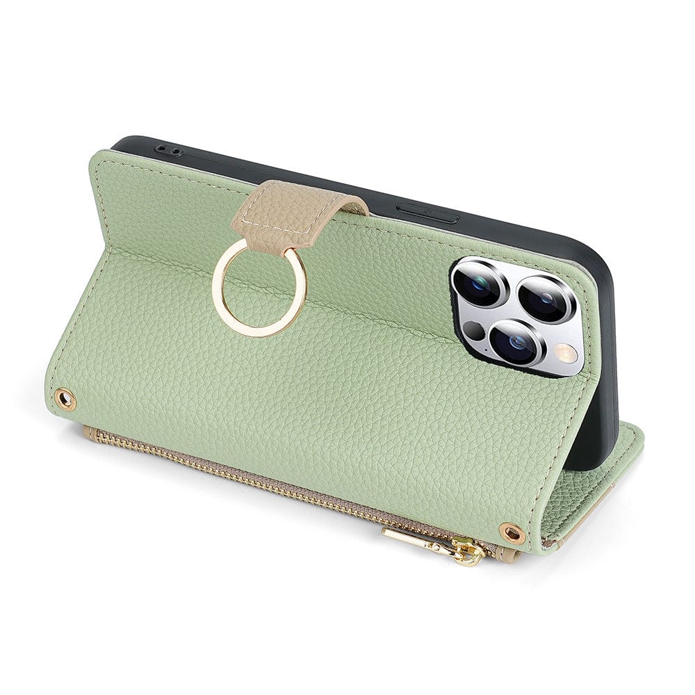 A green iPhone 16 Pro Max Crossbody Wallet Case made of PU leather, featuring a textured surface, built-in mirror, card slots, a ring holder, a zipper pocket, and a hidden foldable stand. The phone boasts a triple-camera setup.