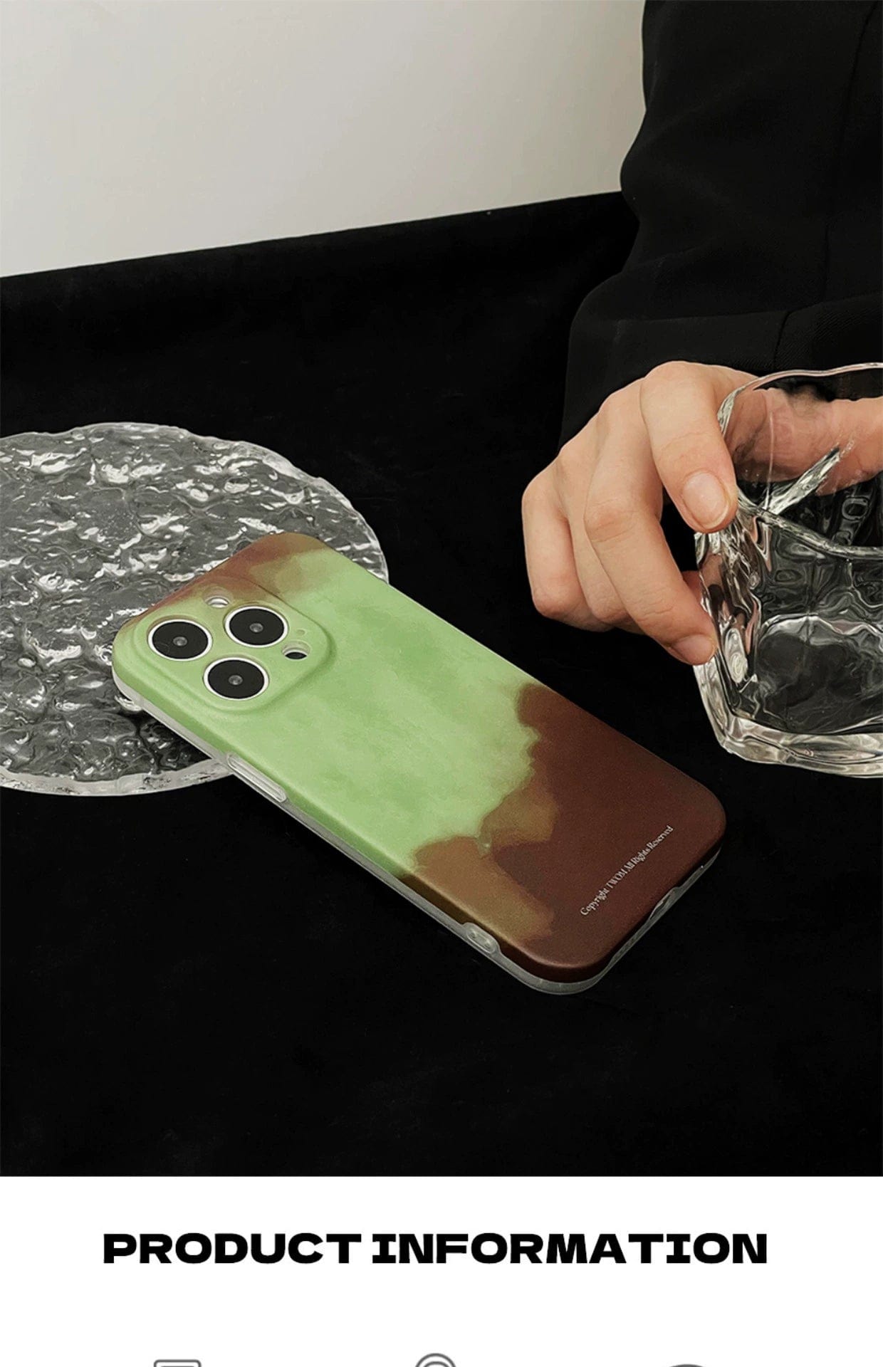 A smartphone with a Midnight Galaxy iPhone 16 Pro Max case, featuring a cosmic starry design, is placed on a black surface. A hand holding a textured glass of water is visible beside the phone. Text at the bottom reads "PRODUCT INFORMATION.