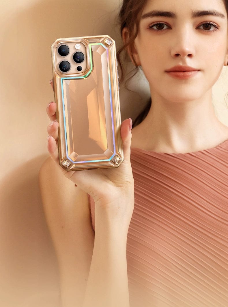 A woman holds a smartphone encased in an iPhone 16 Pro Max Case - Shockproof 360° Clear Anti-Fall Protective Cover, which boasts a striking 3D gem design with metallic accents.