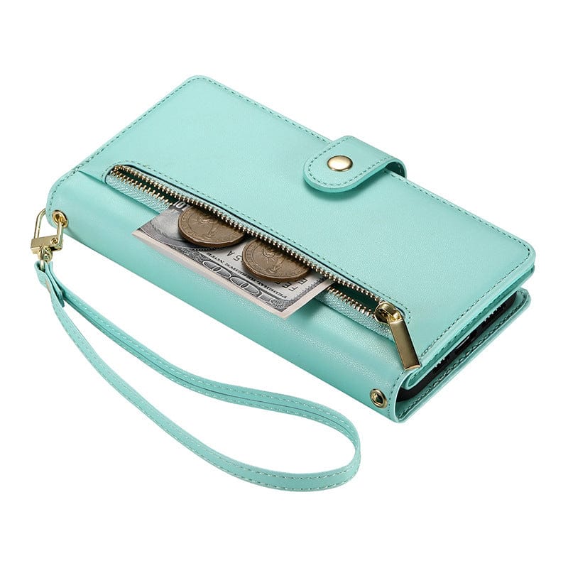 A turquoise, premium leather iPhone 16 Pro Max wallet case with gold hardware and a wrist strap, partially unzipped to reveal two coins and a dollar bill inside.