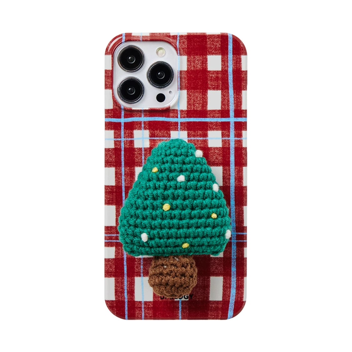 The Festive Knitted MagSafe iPhone 16 Pro Max Case features a holiday plaid design in red and white, adorned with a crocheted applique of a green Christmas tree accented in yellow with a brown trunk. The phone's triple camera setup remains visible at the top left corner.