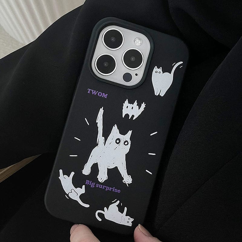 A Big Surprise black cat iPhone 16 Pro Max case with playful cartoon design and illustrations of white cats in various poses, shown against a dark background.