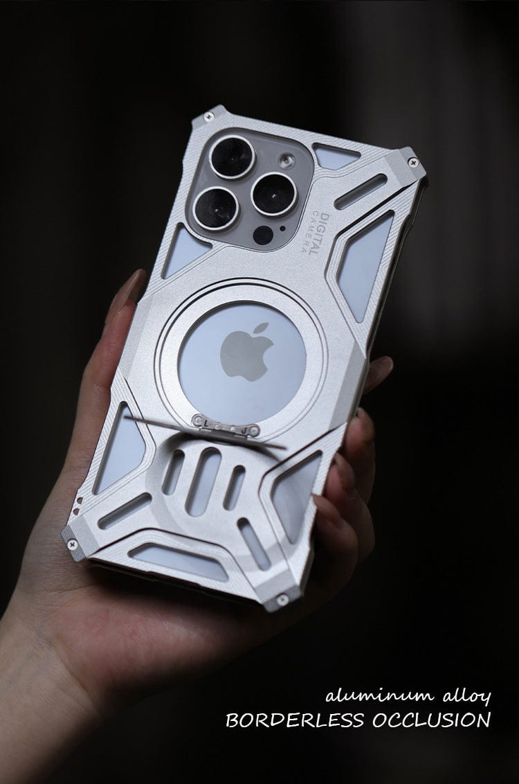 A hand holds the iPhone 16 Pro Max Aerospace Aluminum MagSafe Case, showcasing its metallic, industrial-style finish. The clear Apple logo, three camera lenses, and "aluminum alloy BORDERLESS OCCLUSION" label emphasize its sleek design. Crafted from aerospace aluminum alloy, this case also features MagSafe compatibility for seamless connectivity.