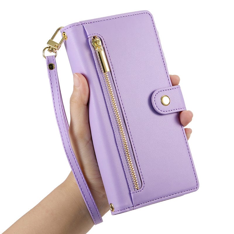 A hand holds a sleek purple wallet with a zipper pocket, button closure, and attached wrist strap, designed as the iPhone 16 Pro Max Wallet Case with Card Holder, Zipper Pocket, and Stand Function crafted from premium leather material.