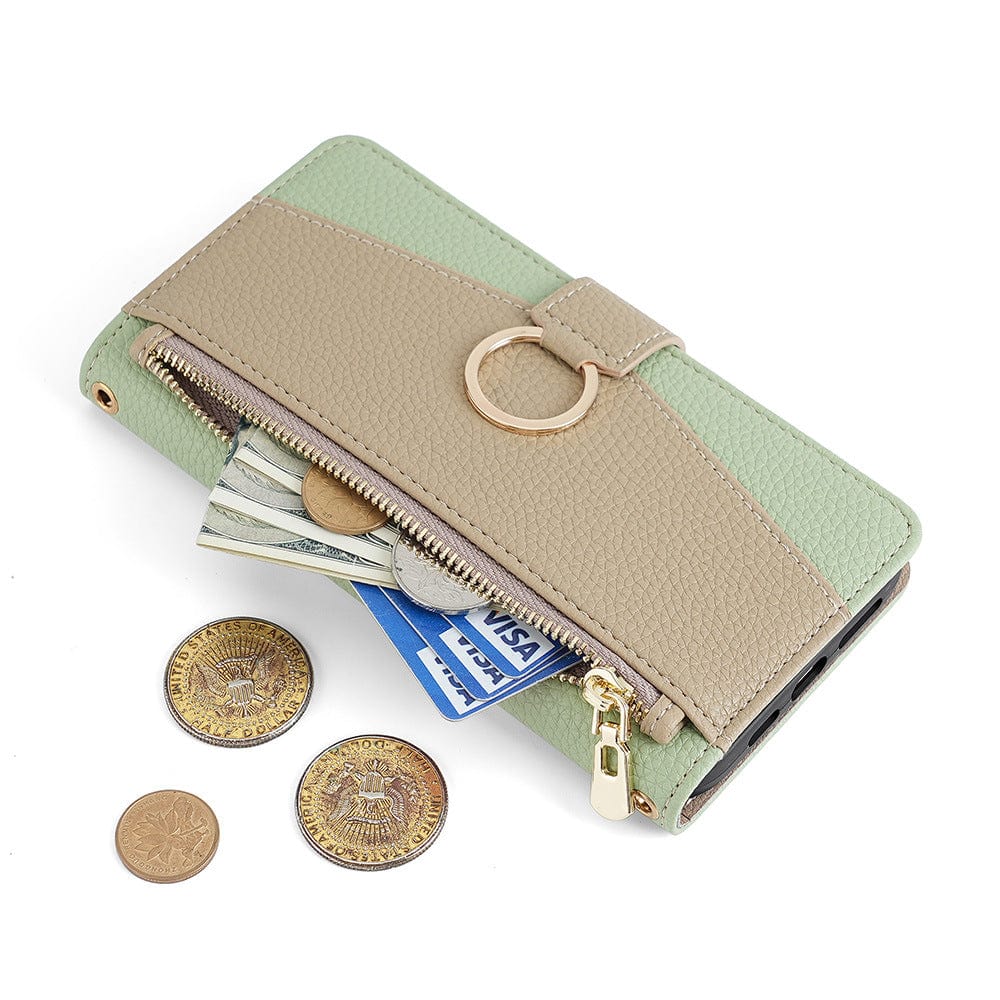 A green and beige iPhone 16 Pro Max Crossbody Wallet Case, featuring a ring detail, is partially unzipped to reveal U.S. dollar bills, two credit cards, and surrounded by four gold-colored coins.