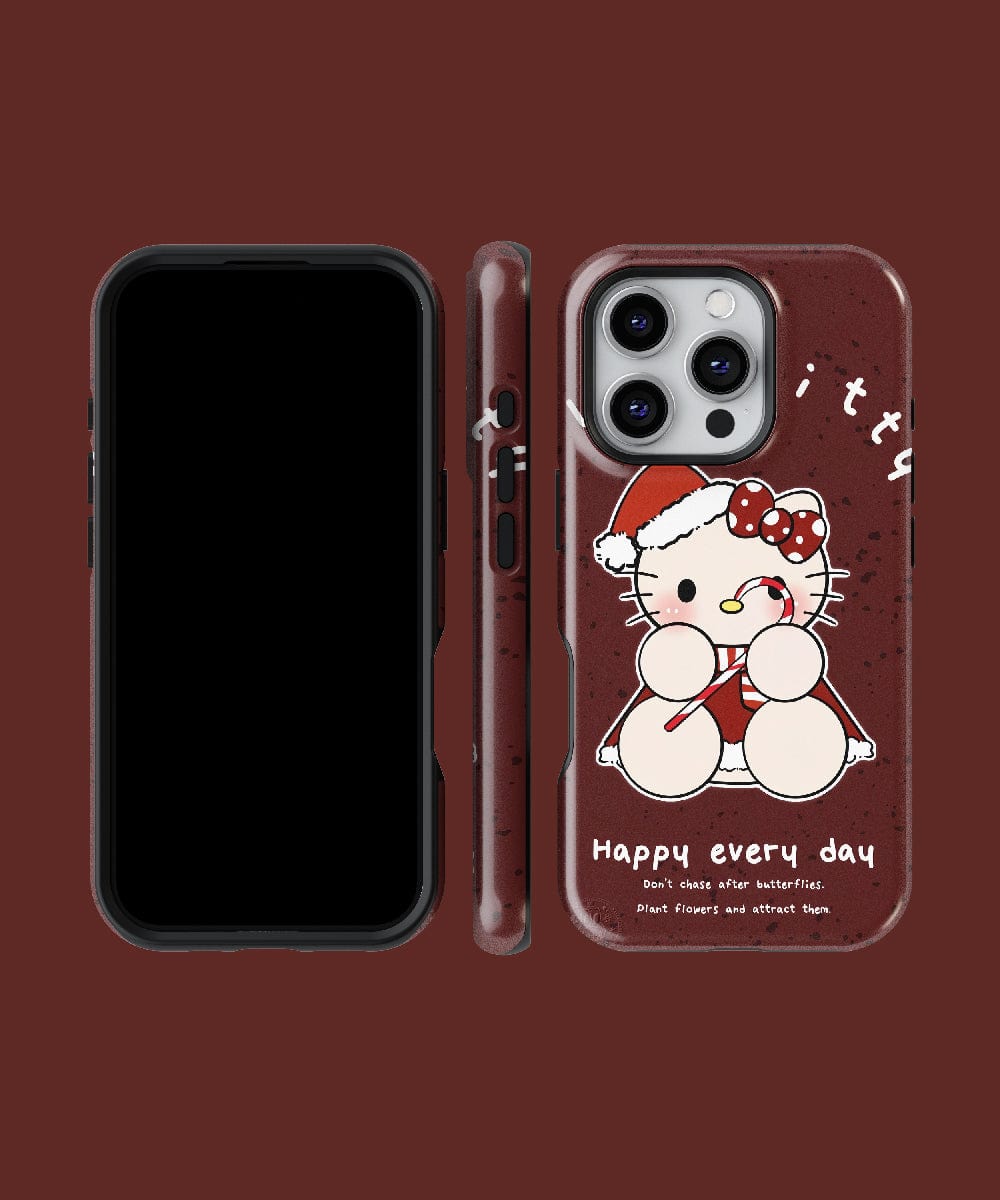 The Christmas Lucky Kitty iPhone 16 Pro Max Case showcases a festive cute cat design with a cartoon cat in a Santa hat and the phrase "Happy every day." This MagSafe-compatible case is displayed from the front, side, and back against a brown background.