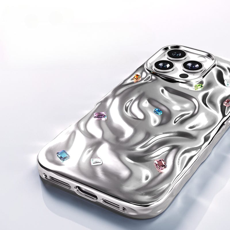 Introducing the iPhone 16 Pro Max Luxury Case: a silver smartphone cover crafted from PC material, featuring a wavy design and multicolored handcrafted gemstone accents, equipped with dual-layer protection and N52 magnets for enhanced durability.