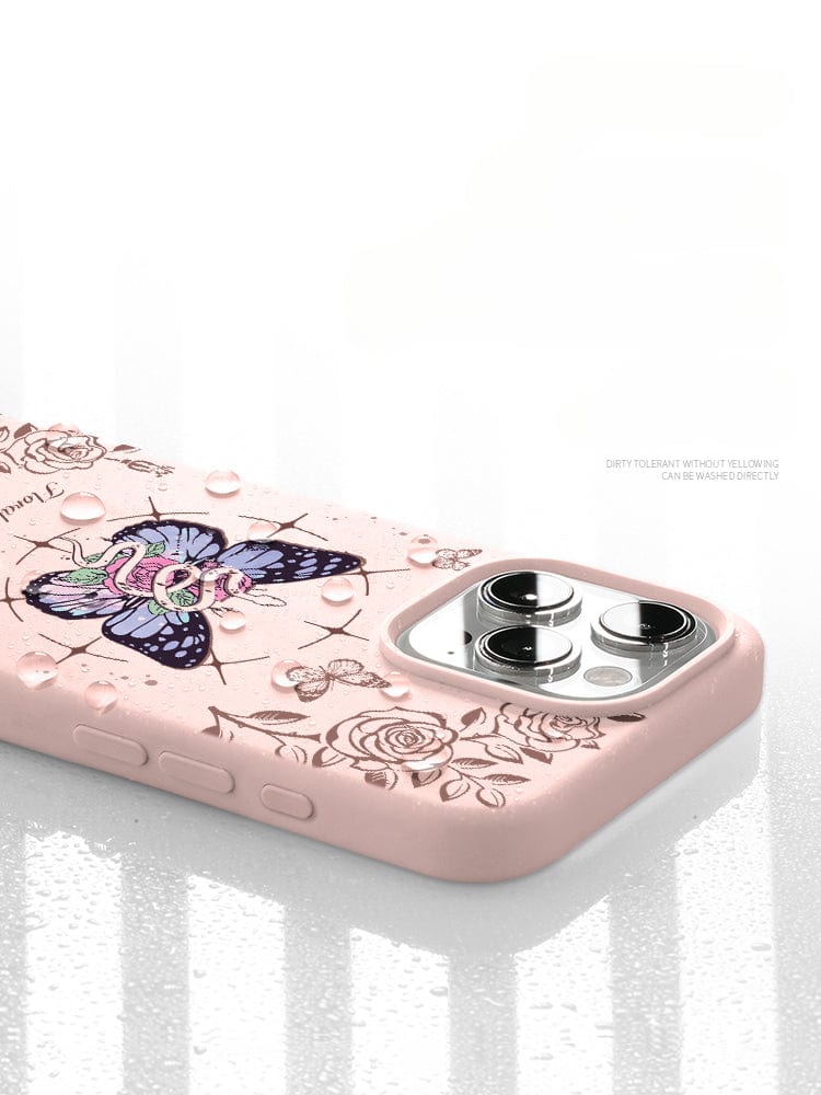 Introducing the iPhone 16 Pro Max Floral Butterfly Case, showcasing a beautiful butterfly and floral design with delicate water droplets on the surface. This case features light text detailing its dirt-resistant and washable properties. Crafted from premium liquid silicone, it provides added durability, shockproof protection, and an anti-yellowing soft touch finish.