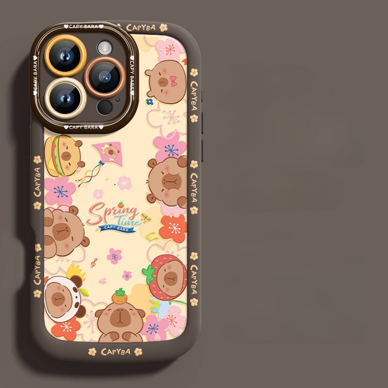 An iPhone 16 Pro Max Cute Bear Silicone Case showcasing playful cartoon bear heads with various accessories. This case features a predominantly dark design accented with floral elements and the "Spring Time" text at its center. It offers not just style but also shockproof protection due to its soft touch liquid silicone construction, ensuring durability and anti-scratch properties.