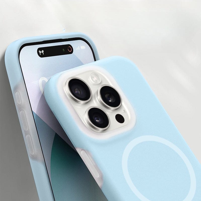 A smartphone with a light blue MagSafe Compatible iPhone 16 Pro Max Case - Premium Liquid Silicone Gel, featuring three rear cameras and a screen displaying a minimalistic design with geometric shapes.