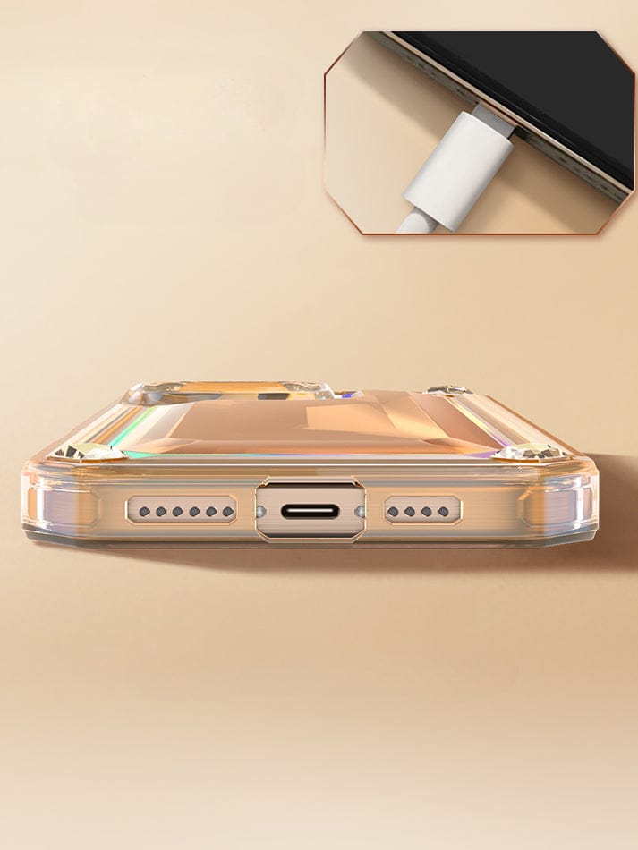 A close-up of a smartphone with the iPhone 16 Pro Max Case - Shockproof 360° Clear Anti-Fall Protective Cover with 3D Gem Design showcasing its charging port. An inset image highlights a charging cable plugged into the port, emphasizing the clear, anti-yellowing material's comprehensive protection.