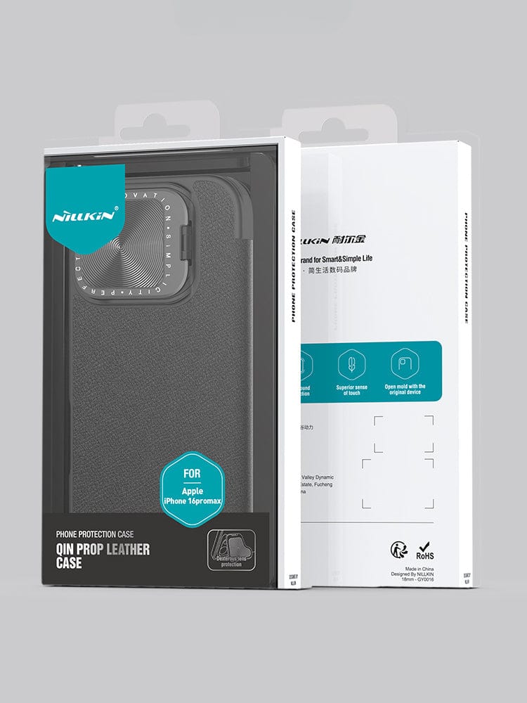 Image of a retail package for the iPhone 16 Pro Max Leather Flip Case with Card Holder. The packaging, in shades of black and white, highlights the leather exterior and features product images along with descriptions on the box, emphasizing its full protection, metal lens cover, and stand feature.