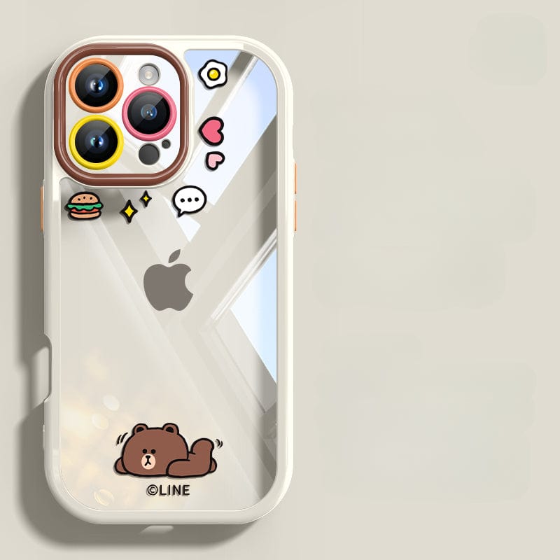 The iPhone 16 Pro Max Case - Cute Cartoon Clear Protective Cover features a transparent back with an adorable cartoon design, including a bear, stars, a burger, a speech bubble, and a heart surrounding the iconic Apple logo. Additionally, it provides shockproof protection for your device and includes an anti-yellowing feature.