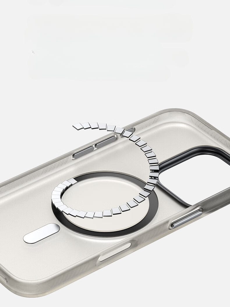 The iPhone 16 Pro Max MagSafe Case | X-002 Hdens Matte Finish Shockproof Cover features a transparent design with two metal rings, one detached and hovering above the case. Enhancing its durability, the shockproof technology ensures maximum protection alongside an elegant Hdens matte finish.