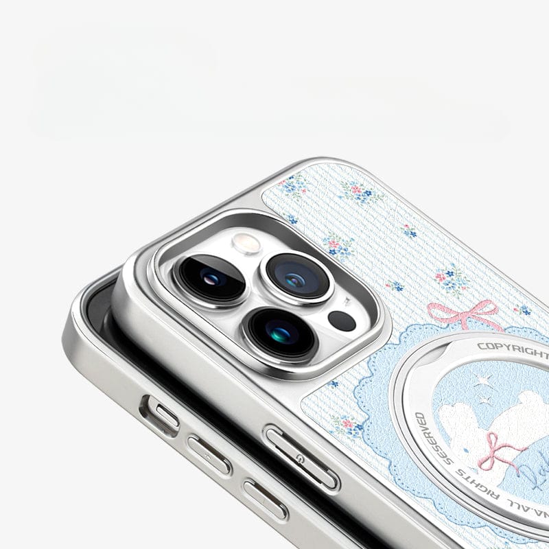 The Cute iPhone 16 Pro Max Case presents a captivating floral rabbit design and an integrated magnetic stand. Featuring SGS-certified drop protection, it includes three camera lenses and sleek silver edges for a modern touch.