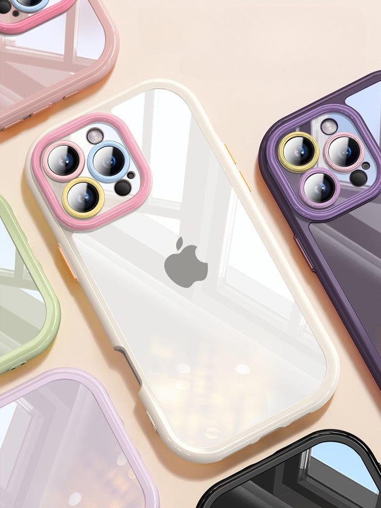 Several iPhone 16 Pro Max Clear Cases - Transparent Silicone Protective Covers with Colorful Camera Rings, Anti-Yellowing, Shockproof and Slim Fit are arranged on a surface. The cases feature backs that show off the Apple logo.