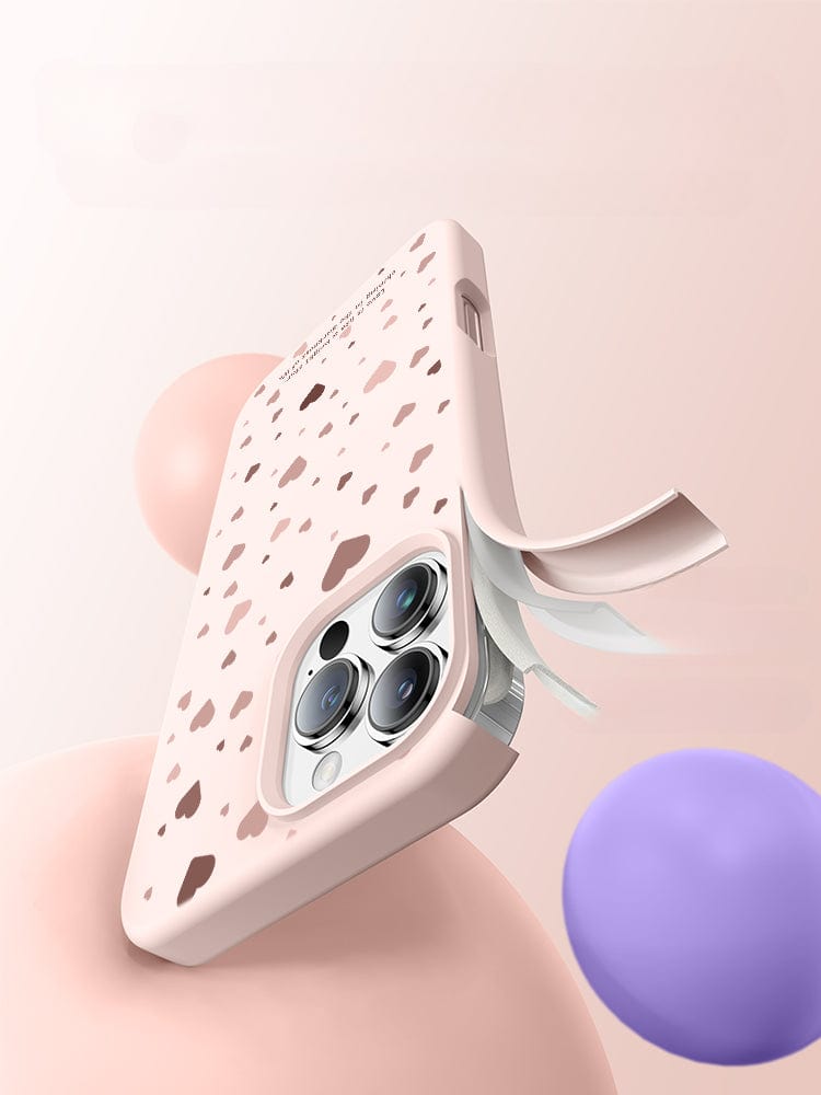 Image of the iPhone 16 Pro Max Case - Soft Liquid Silicone Protective Cover with Shockproof Design and Anti-Fingerprint Coating, featuring a speckled design, a cutout for a triple camera setup, and several adhesive notes emerging from the side. Made from food-grade silicone, its dust-resistant liquid silicone ensures durability. The background includes pink and purple spheres.