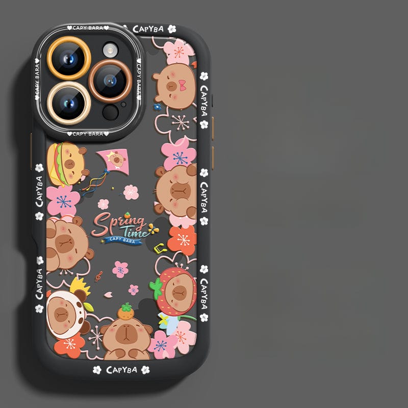 An iPhone 16 Pro Max Cute Bear Silicone Case showcasing playful cartoon bear heads with various accessories. This case features a predominantly dark design accented with floral elements and the "Spring Time" text at its center. It offers not just style but also shockproof protection due to its soft touch liquid silicone construction, ensuring durability and anti-scratch properties.