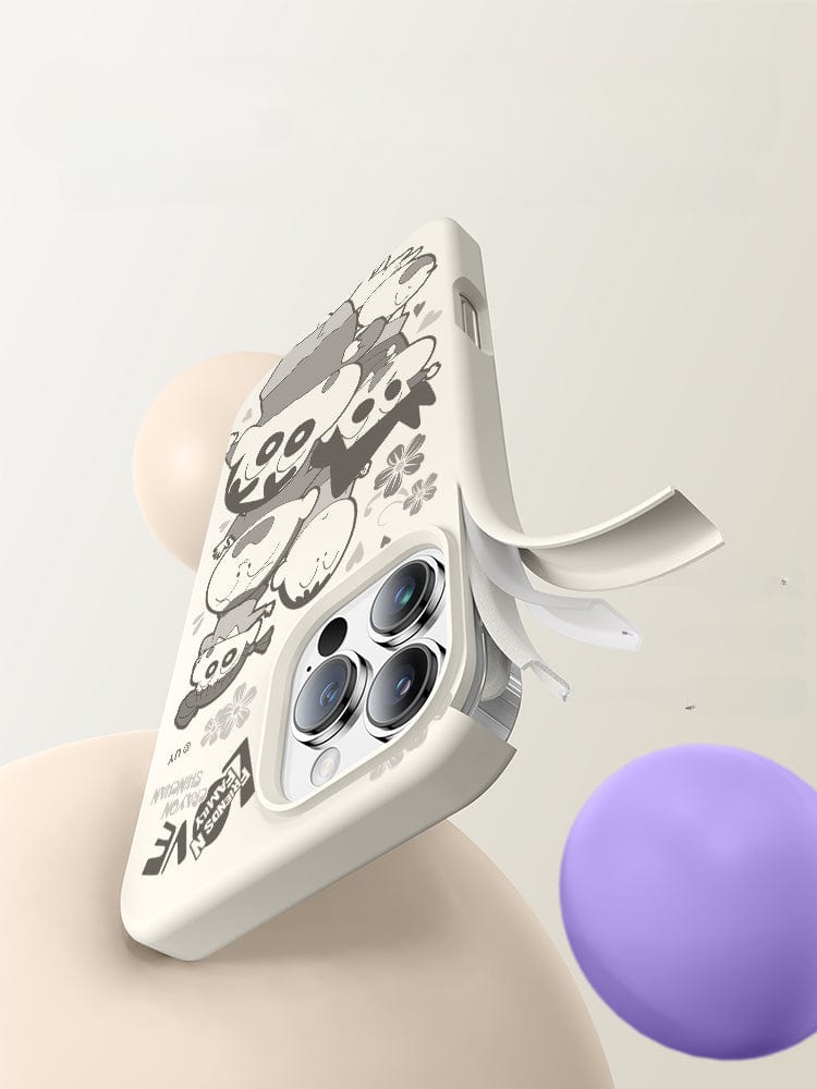 A white iPhone 16 Pro Max Crayon Shinchan Friends Case, featuring a cartoon panda design, is displayed against a light background with floating beige and purple spheres. The high-quality liquid silicone case offers triple-layer shockproof protection, and the phone is partially visible inside the case.