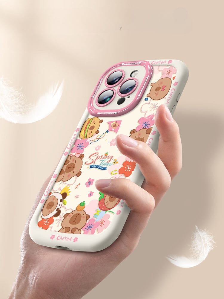 An iPhone 16 Pro Max Cute Bear Silicone Case showcasing playful cartoon bear heads with various accessories. This case features a predominantly dark design accented with floral elements and the "Spring Time" text at its center. It offers not just style but also shockproof protection due to its soft touch liquid silicone construction, ensuring durability and anti-scratch properties.