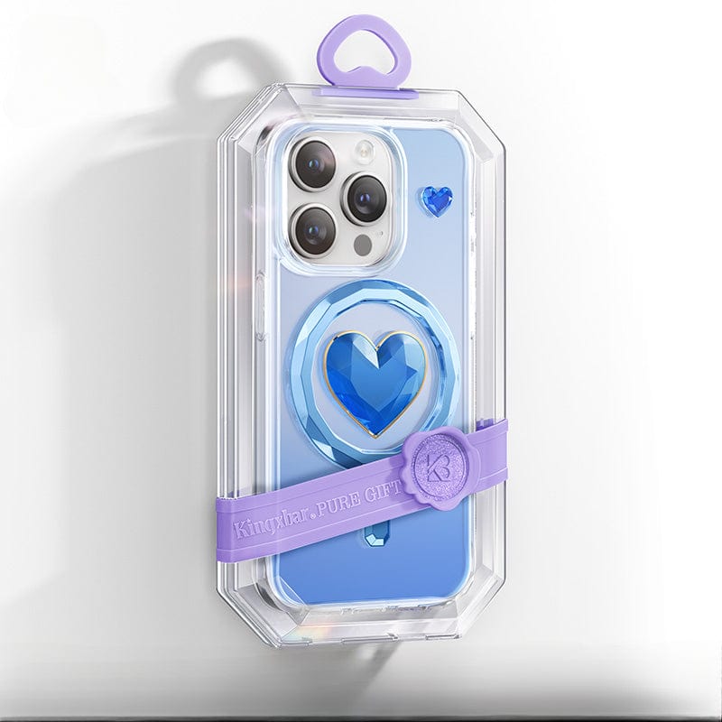 The iPhone 16 Pro Max Clear Case boasts a sophisticated blue heart design and is MagSafe compatible, presented in transparent packaging. Its crystal-clear appearance enhances its stylishness, while a purple band labeled "Kingxbar PURE Gift" adds an element of allure.