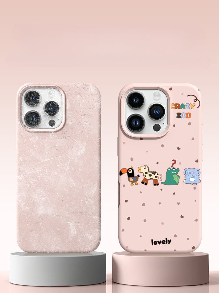 Two phones on stands: the left phone has a plain, textured pinkish case made of premium liquid silicone, while the right phone features an iPhone 16 Pro Max Crazy Zoo Case with a cute animal design and "Cute Crazy Zoo" text.