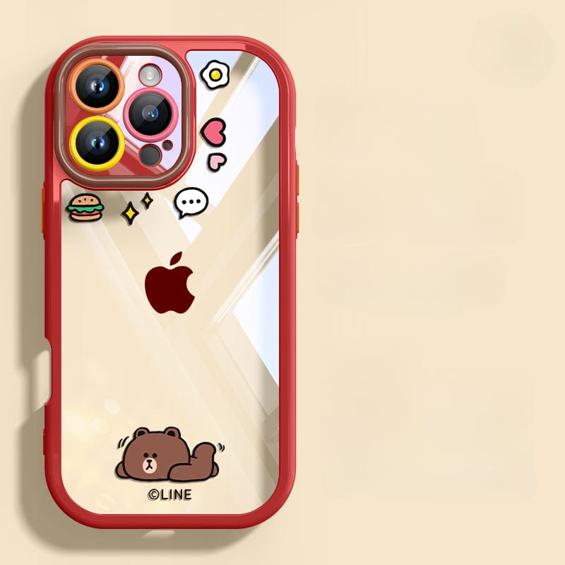 A smartphone with an iPhone 16 Pro Max Case - Cute Cartoon Clear Protective Cover featuring a red, shockproof bumper, and decorated with various stickers including animated emoticons, a hamburger, and a bear lying down. The phone prominently displays the Apple logo on its anti-yellowing transparent back.