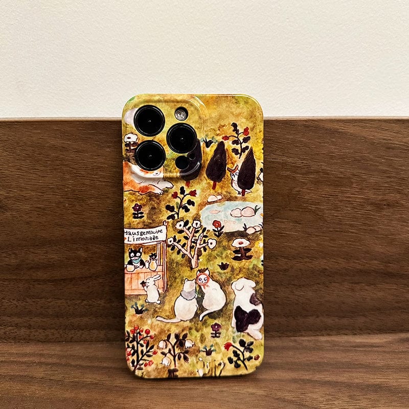 A smartphone adorned with the "Charming Forest Friends iPhone 16 Pro Max Case - Whimsical Animal Village Design with Full Protection" showcases a colorful and illustrated scene featuring various whimsical woodland animals, a small cottage, trees, and flowers. The design includes rabbits, a bear, birds, and three camera lenses visible at the top left corner.