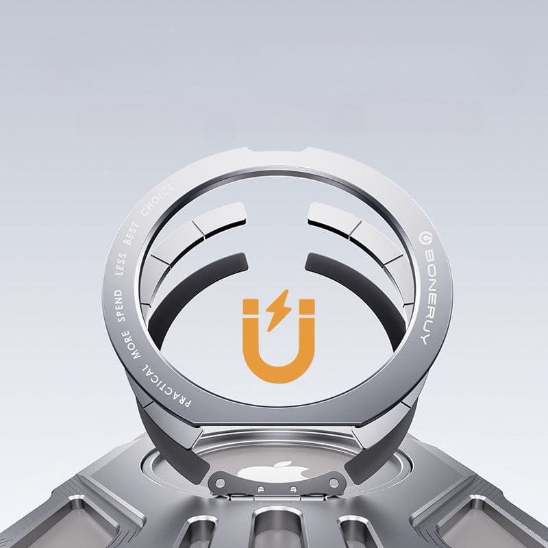 Close-up image of the iPhone 16 Pro Max Aerospace Aluminum MagSafe Case with a metallic circular device made from Aerospace Aluminum Alloy, featuring a logo with a stylized magnet and lightning bolt. The text around the circle reads, "Practical, more to spend, less is best, choice." This design includes 360° Ring Kickstand and Shockproof Metal Cover for enhanced protection.