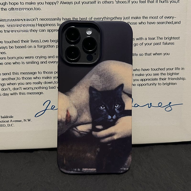 An Artistic Portrait iPhone 16 Pro Max Case - Vintage Black Cat and Woman Design, Ultra-Slim, Full Protection, showcasing an artistic image of a person holding a black cat close to their chest with an indistinct text and handwriting in blue background.