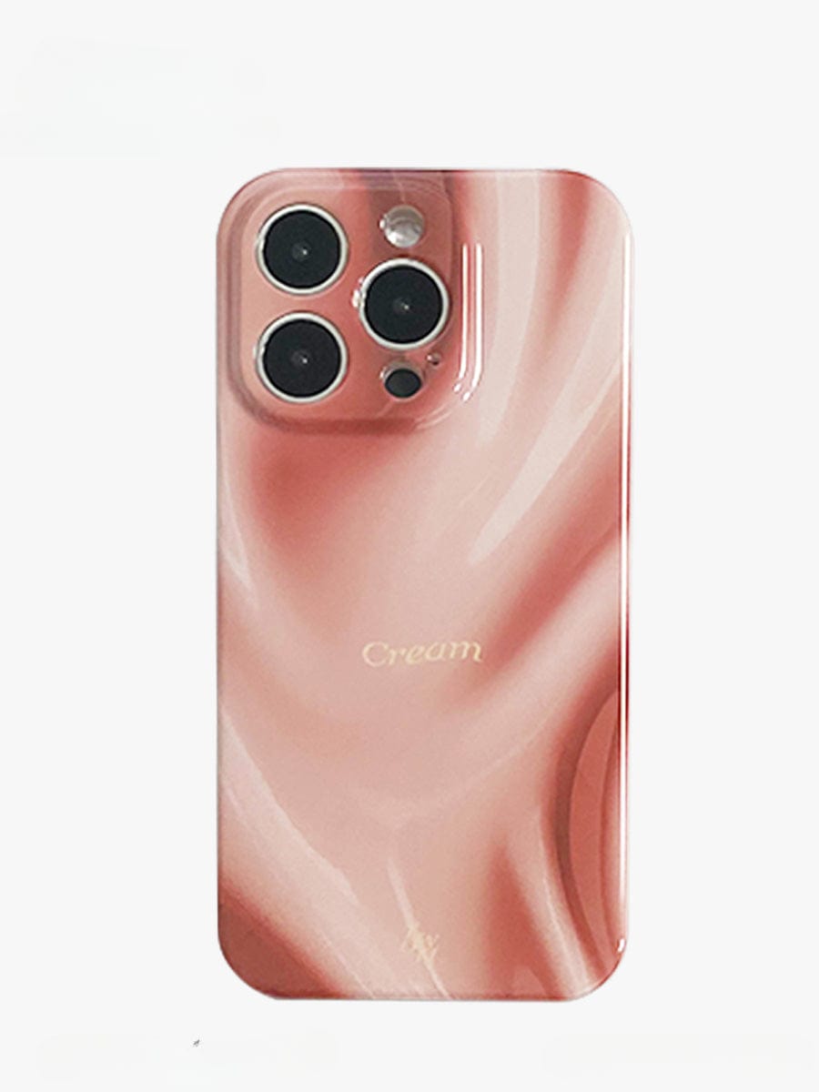 A smartphone with a Silky Rose iPhone 16 Pro Max Case, featuring an elegant marble design in pink and cream, three prominent camera lenses, an additional smaller sensor, and the word "Cream" printed in gold at the center of the luxurious all-inclusive protective cover.