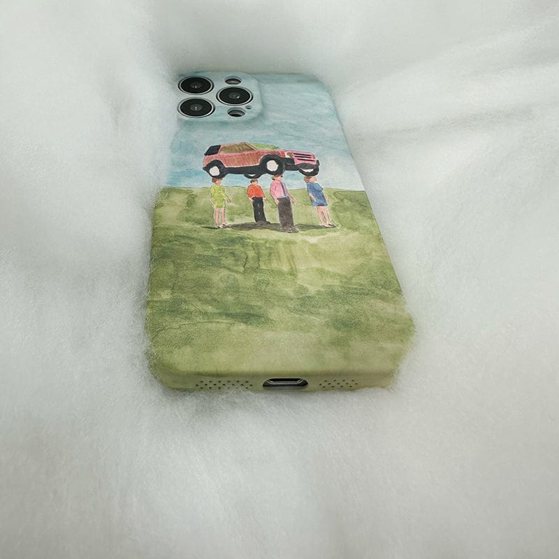 A smartphone encased in the Surreal Car Lift iPhone 16 Pro Max Case - Whimsical Watercolor Art with Full Protection rests on a soft, fluffy white surface. The case showcases an artwork of four people lifting a red car above their heads while standing in a green field under a blue sky.