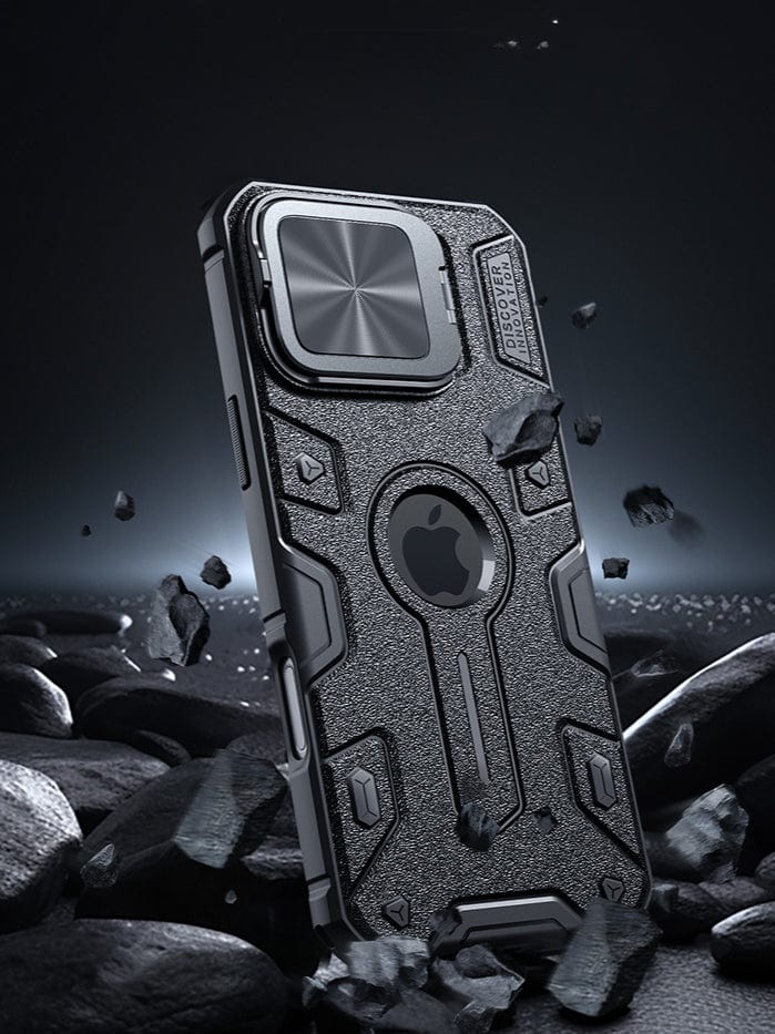 Rugged MagSafe iPhone 16 Pro Max Case in black, featuring a textured back, hinged metal camera shield, precise cutouts, and compatibility with MagSafe, showcased on a rocky surface.