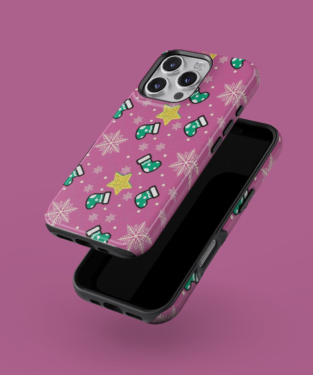 A pair of Festive Stocking iPhone 16 Pro Max cases featuring a pink holiday design adorned with stars, snowflakes, and mittens, compatible with MagSafe.