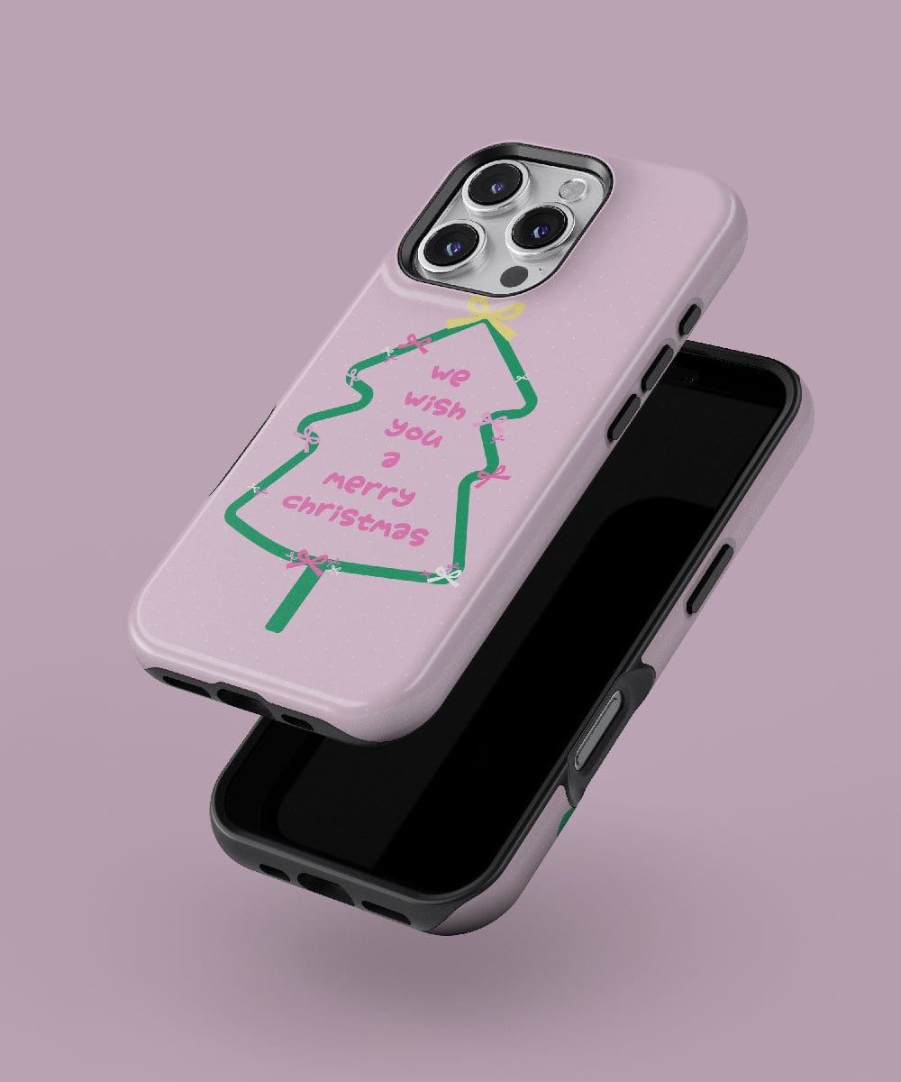 Introducing the Merry Christmas Tree iPhone 16 Pro Max Case, featuring a festive pink and green holiday design. This case boasts a cheerful "We wish you a Merry Christmas" message against a soft mauve background. It provides dual-layer protection while being MagSafe-compatible, perfectly combining seasonal spirit with practicality.