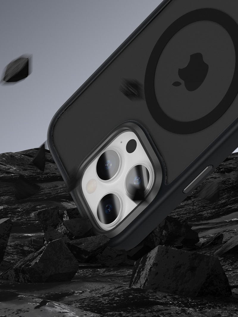 Close-up of a smartphone with the iPhone 16 Pro Max MagSafe Case in the Golden Shield design, showcasing its Aluminum Alloy Camera Frame and Anti-Fingerprint, Shockproof Protection, against a rugged rocky background with floating debris.