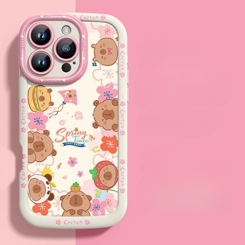 An iPhone 16 Pro Max Cute Bear Silicone Case showcasing playful cartoon bear heads with various accessories. This case features a predominantly dark design accented with floral elements and the "Spring Time" text at its center. It offers not just style but also shockproof protection due to its soft touch liquid silicone construction, ensuring durability and anti-scratch properties.