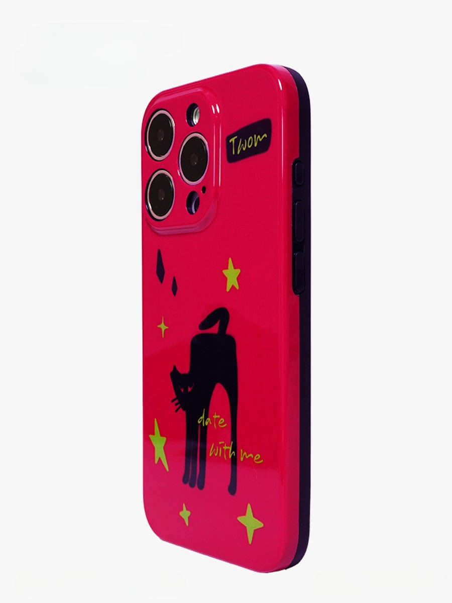 A bold red iPhone 16 Pro Max case featuring a black cat and yellow stars design, with the text "Twom" on it and "Dare With Me" near the bottom.